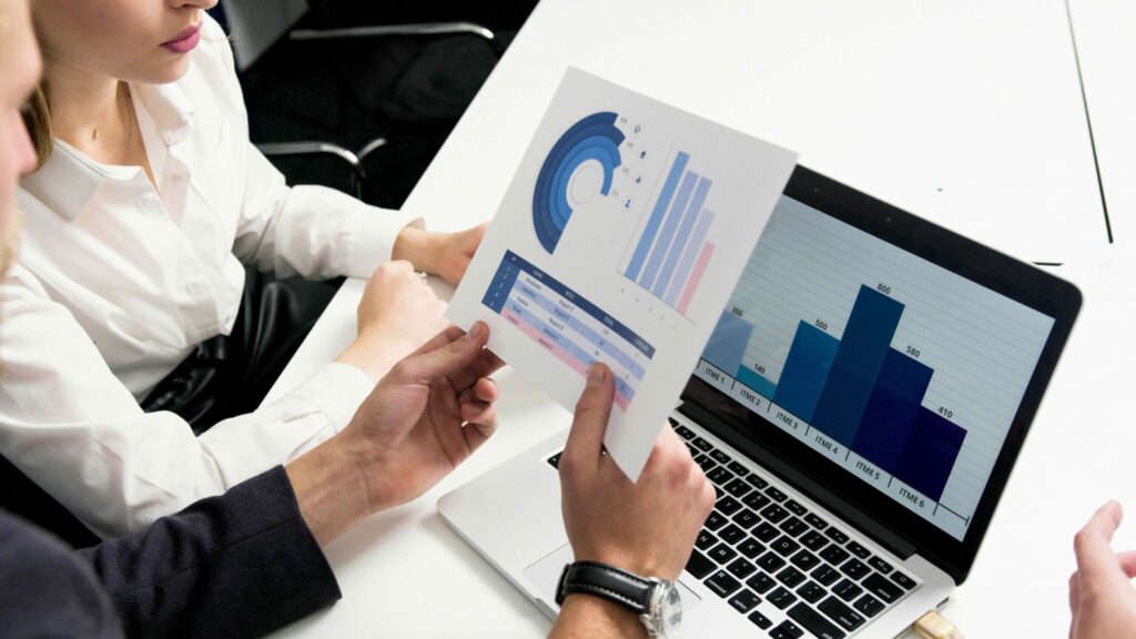 A group of business analysts reviewing charts.